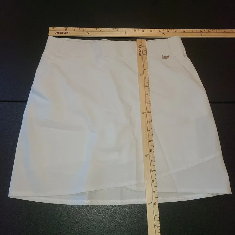 Greg Norman White Golf Skort Tennis Athletic Sz S UPF 30+ Stretch Pockets Preppy